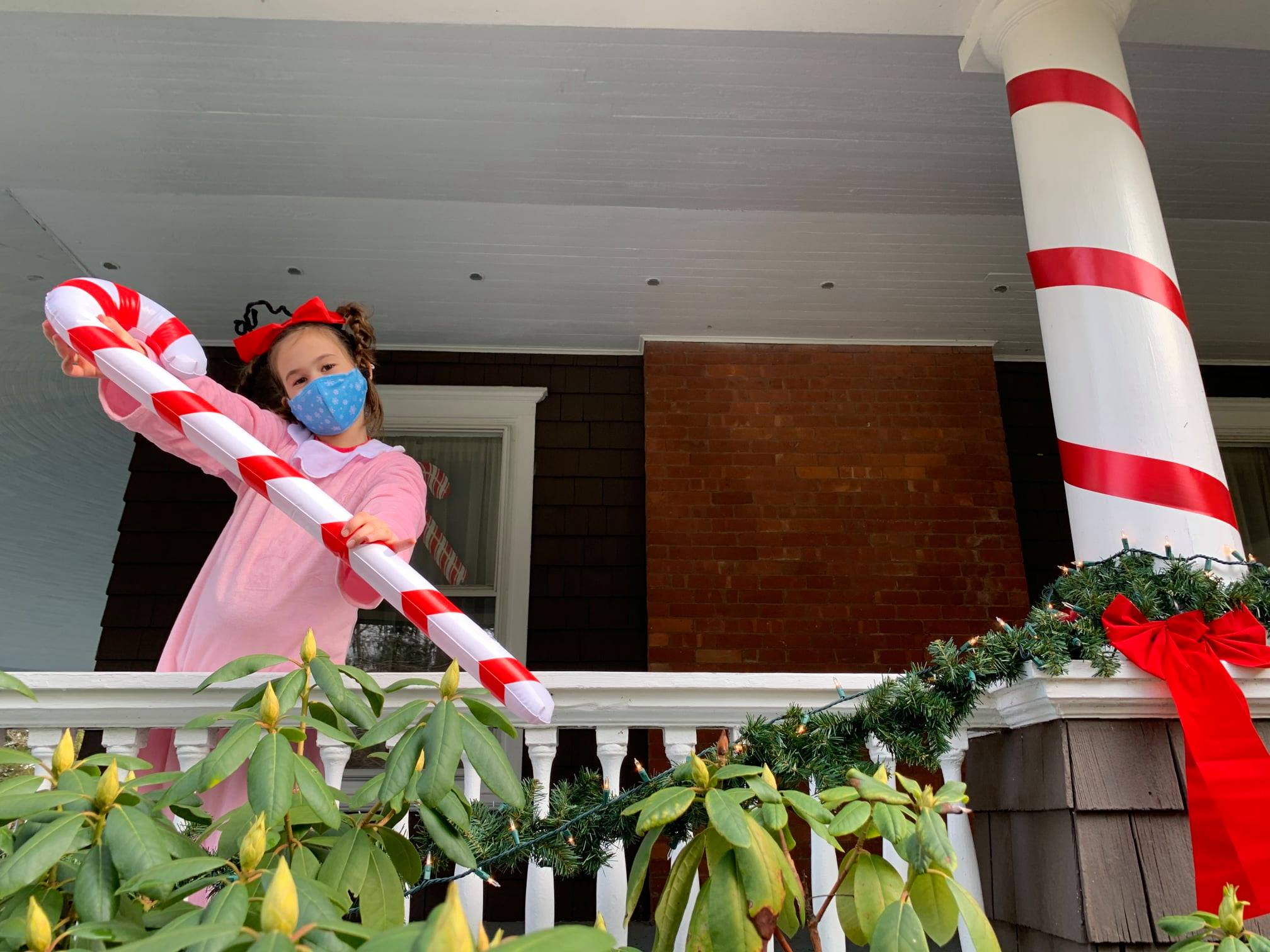 Candy Cane Hunt Drive Thru cindy lou who waving a jumbo candy cane